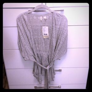 Anthropologie sweater wrap with tie around waist.